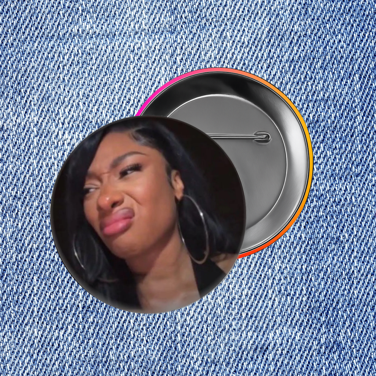 A close-up of a person's face with large hoop earrings, set against a denim fabric background.