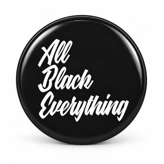 a black circular object with white text that reads "All Black Everything".
